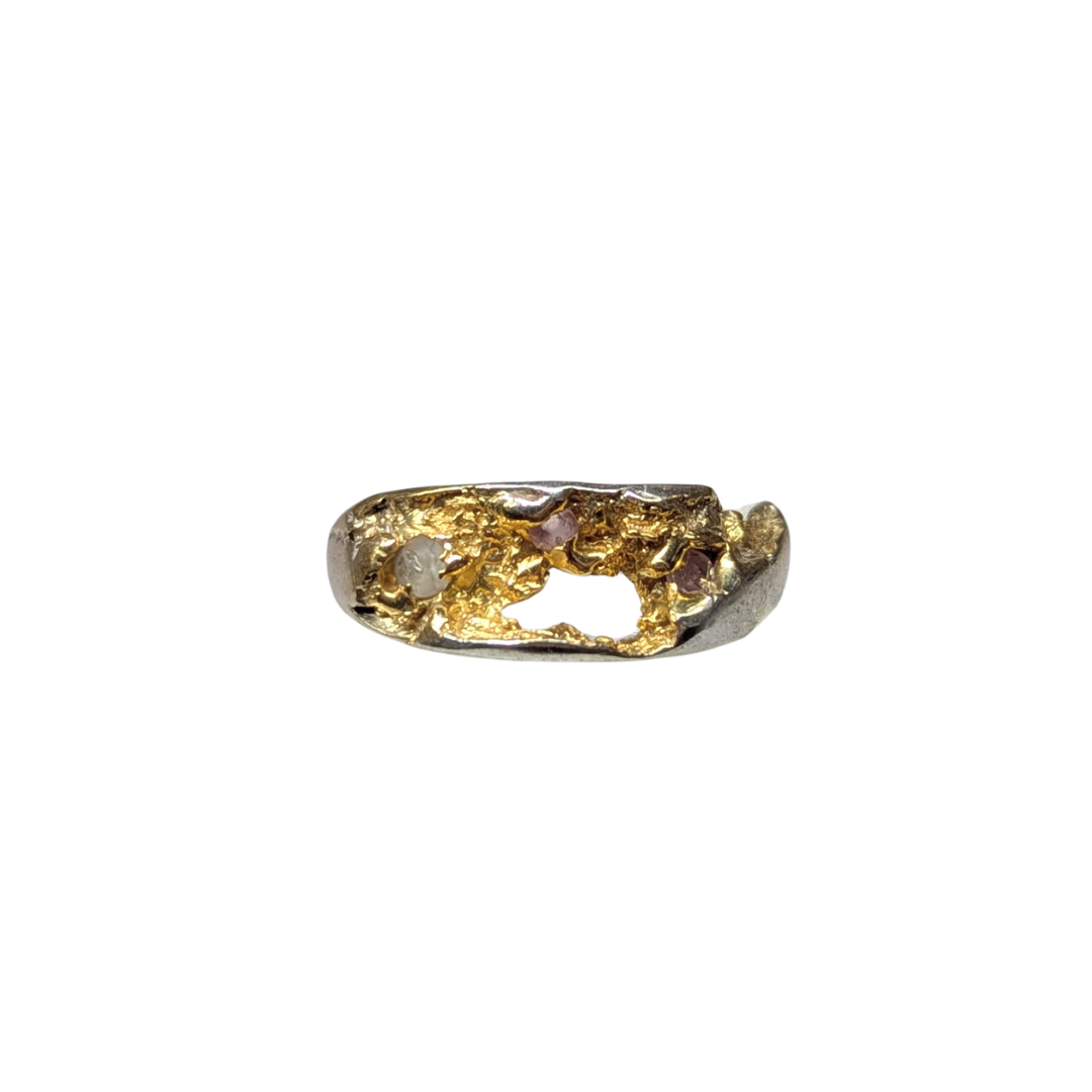 CLAIRE QUICK - Beneath the Surface carved textured sterling silver ring with 3 different shades of pink sapphires, and the textured surface gold plated