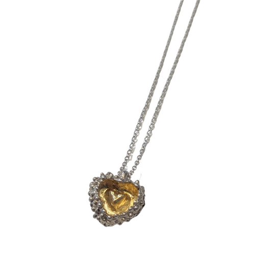 CLAIRE QUICK - Hand carved silver heart with the smaller heart gold plated with an external Bobble surface texture