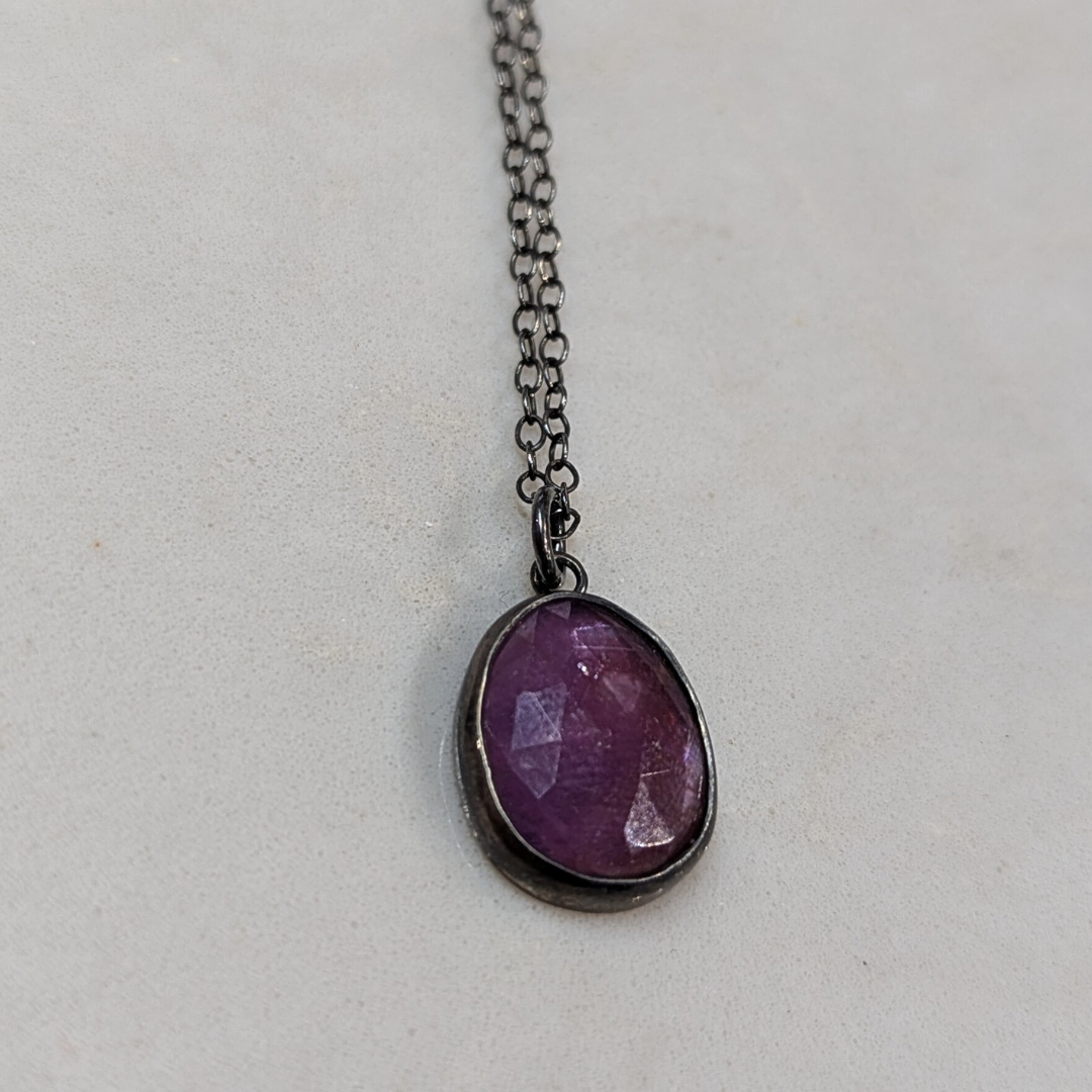 ANNE MORGAN - Ruby Star Sapphire set in oxidised silver on a s/s ox chain 20"