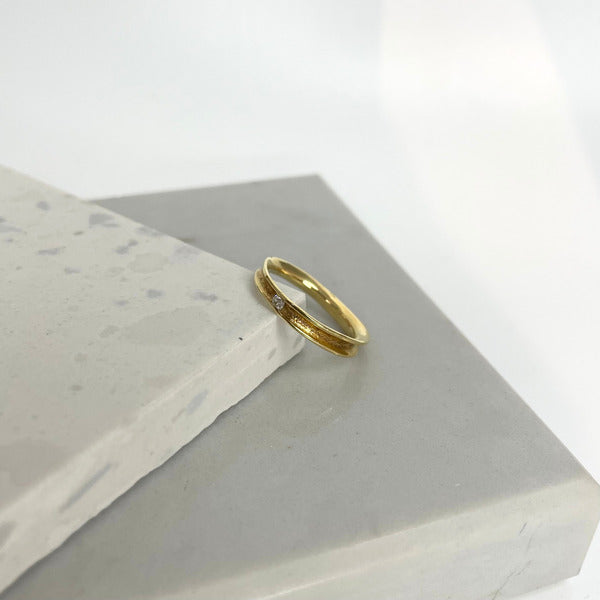KATE HODGSON - 18ct Yellow Gold Tension Set Single Diamond Band
