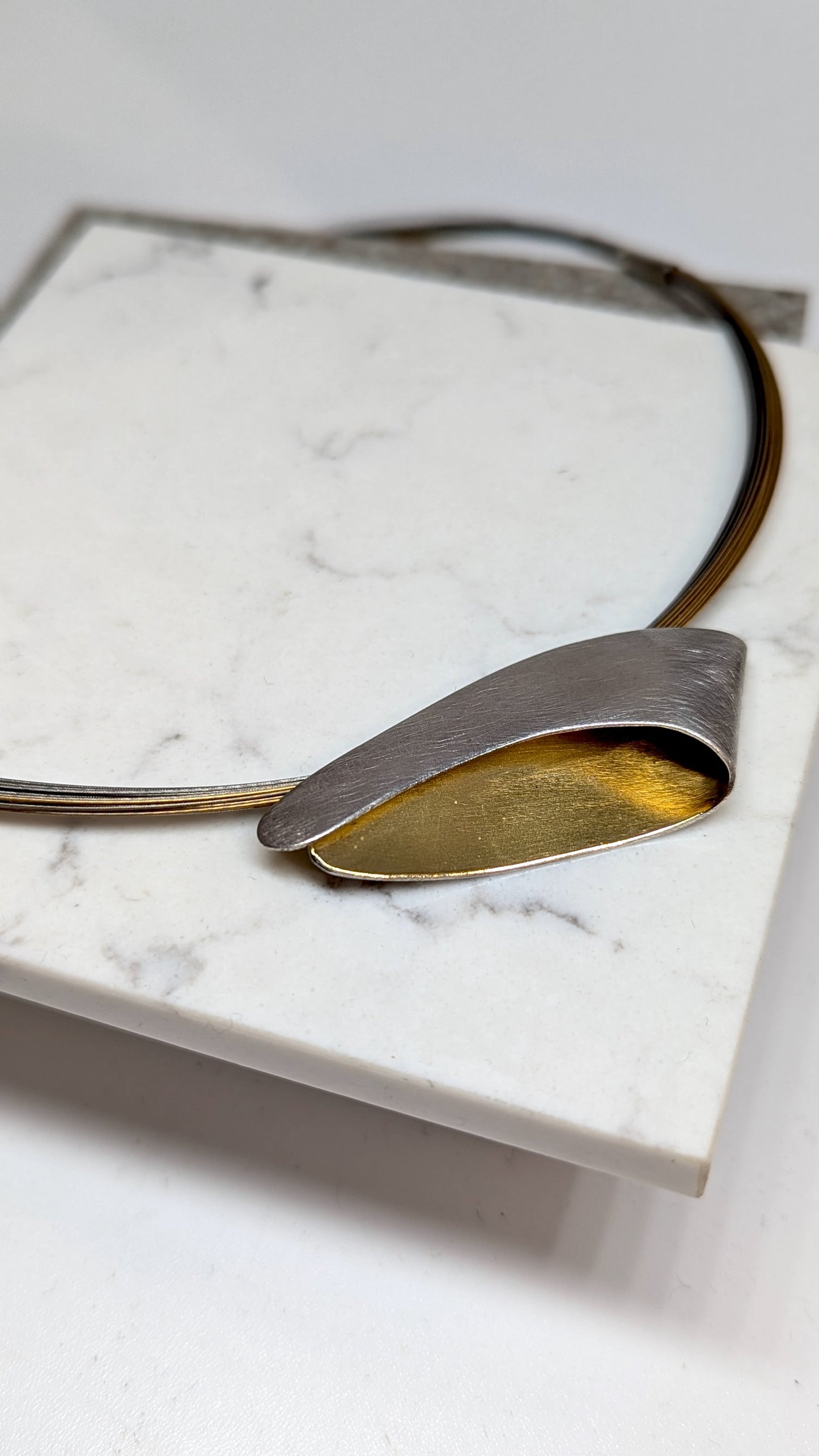 MANU Silver and 22ct gold pendant on bi col coil multi strand