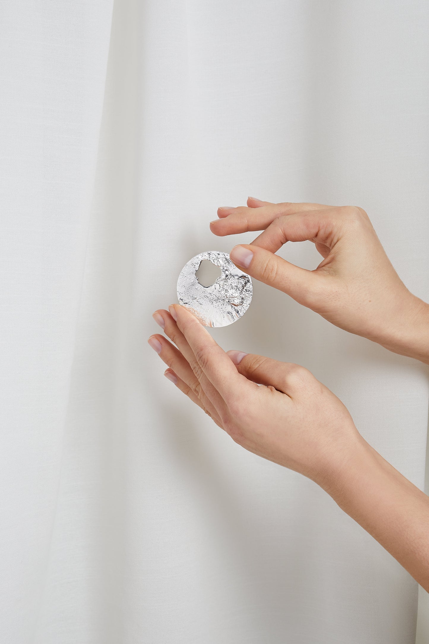 ANNE MORGAN - Reticulated circular silver brooch