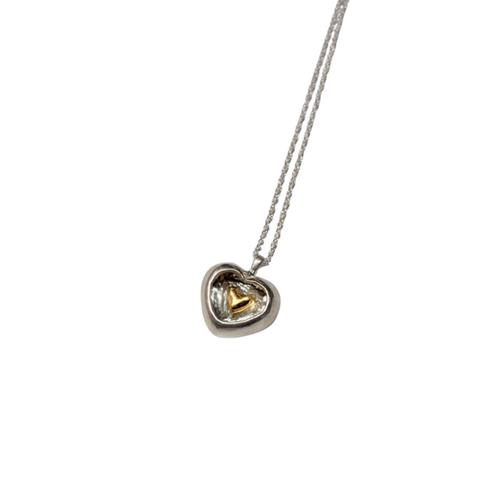CLAIRE QUICK - Hand carved silver heart with a smaller heart carved inside