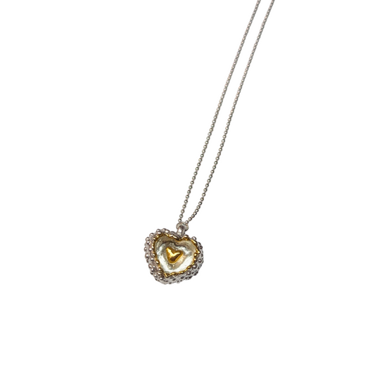 CLAIRE QUICK - Hand carved silver heart with inside and the smaller heart