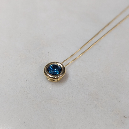 ANNE MORGAN - RBC Blue treated diamond (.49ct)  on threaded rub over setting in 18ct