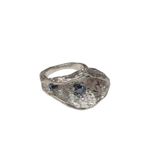 CLAIRE QUICK - Deep off set textured cup ring with 3 blue moissanites in the cup