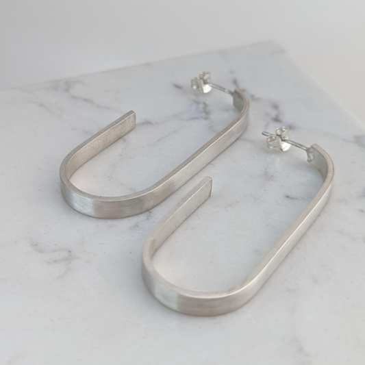 LUCY BURKE - J Shaped Silver Brushed Hoops