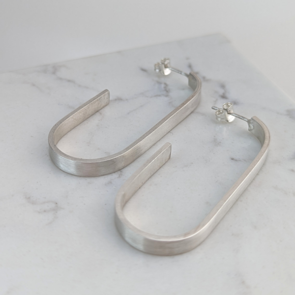 LUCY BURKE - J hoops small silver