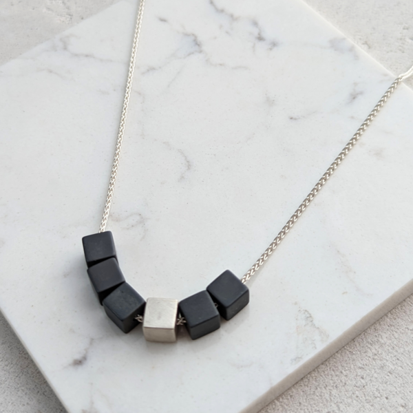 LUCY BURKE -  Hematite cube necklace w silver cube/18"spiga chain & t-bar