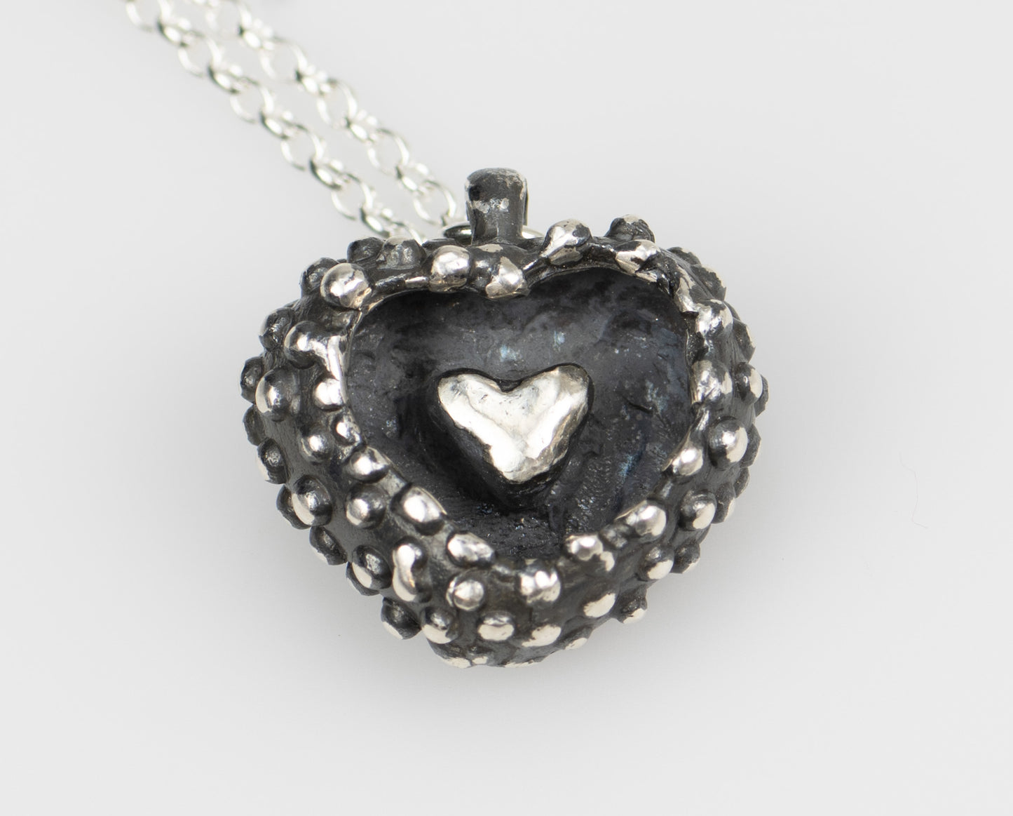 CLAIRE QUICK - Hand carved silver heart with an oxidised finish