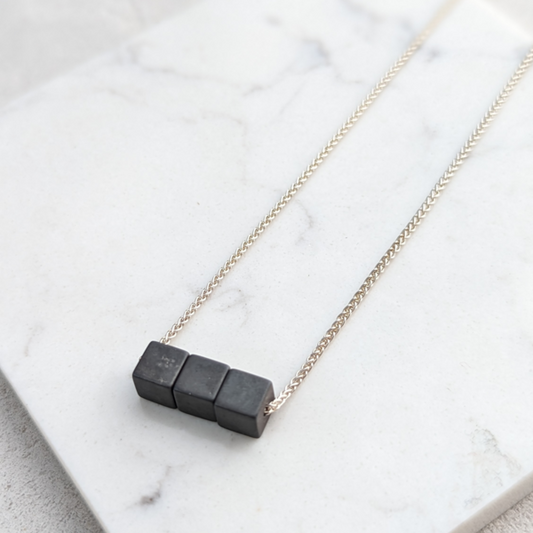 LUCY BURKE - Hematite 3 cube necklace on 18" spiga chain