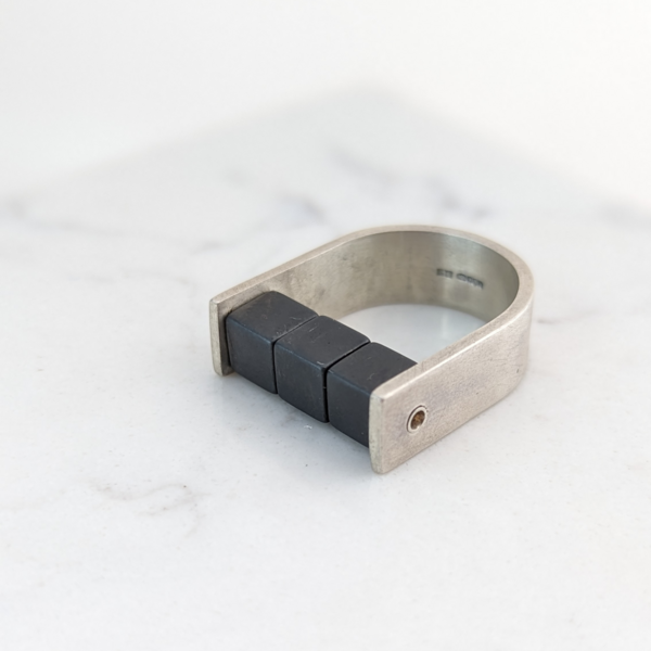 LUCY BURKE -  U Wide Silver Ring with Hematite Cubes