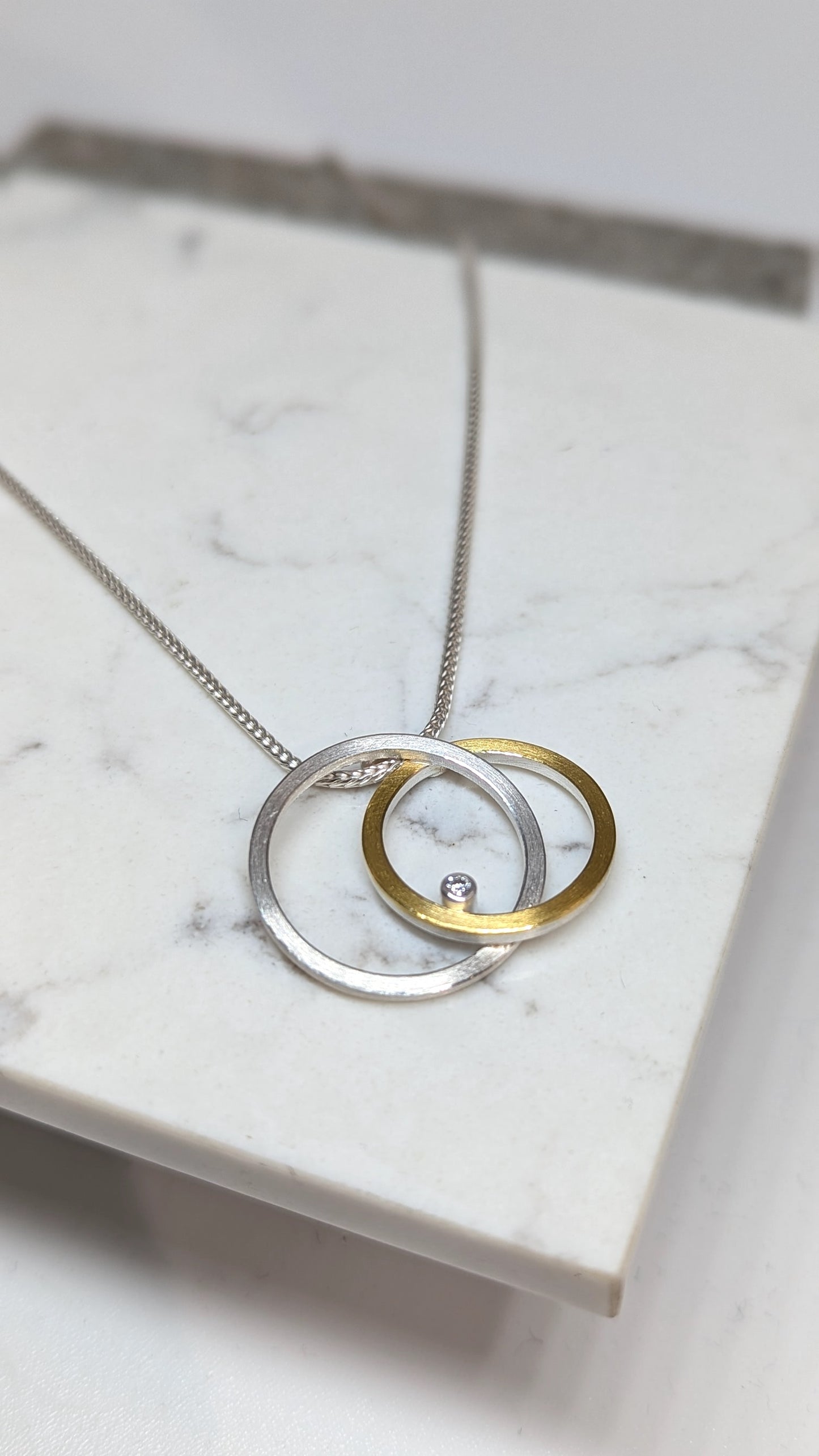 MANU  22CT laminated gold and silver circle necklace with 0.03ct diamond