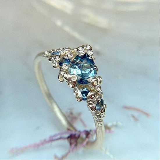 AMI PEPPER - Organic Pembrokeshire Sea Blue and Golden Barnacle Ring with Sapphires