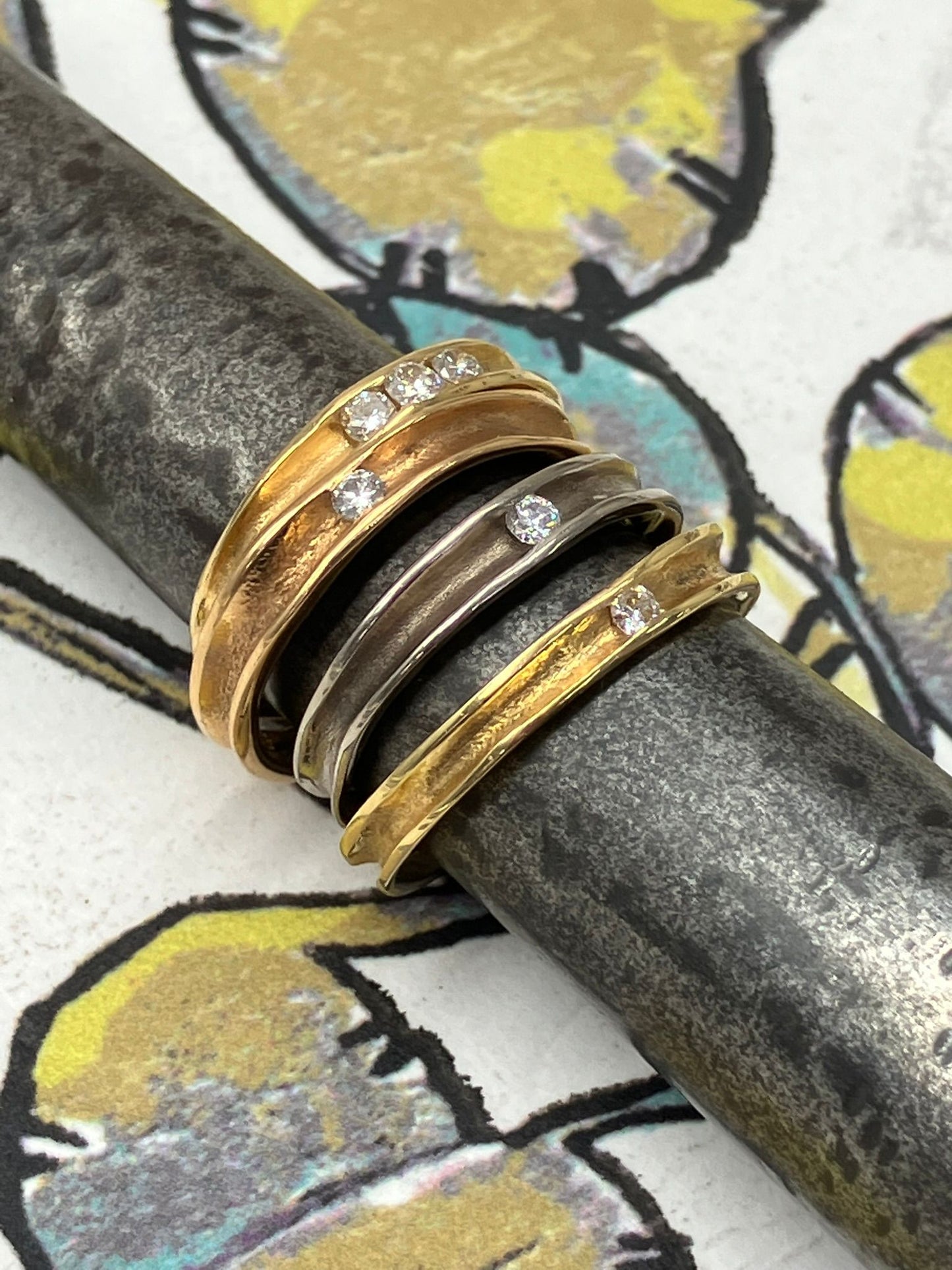 KATE HODGSON - 18ct Yellow Gold Three Stone Tension Set Diamond Band